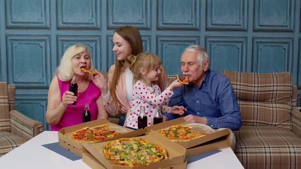 Happy Family Having Lunch Party Feed Each Other with Pizza Laughing Enjoying Meal Together at Home alt