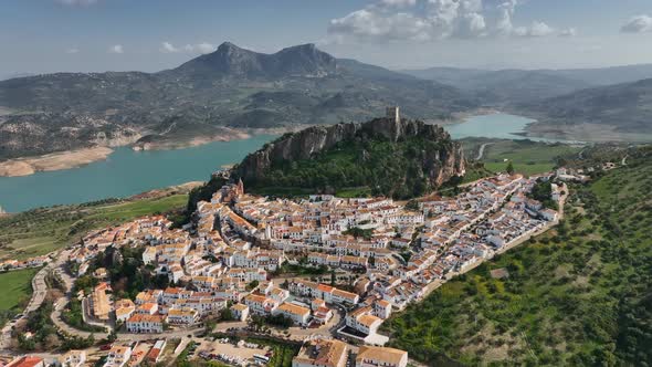 Flying Over the Orange Roofs of the Town Fortress on the Mountain and the View of the River in alt