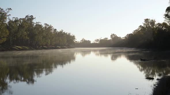 Scenic View of Fog Floating Over the River at Sunrise in a Clear Morning.Nature Concept