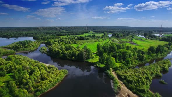 AERIAL Fly Over Clear Blue River and Green Native Forest in Middle Europe, Russia, Tatarstan