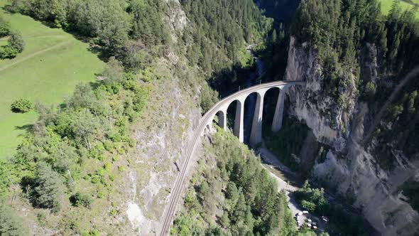 Landwasser Viaduct in Swiss Alps in Summer Aerial View on Green Mountain Valley alt