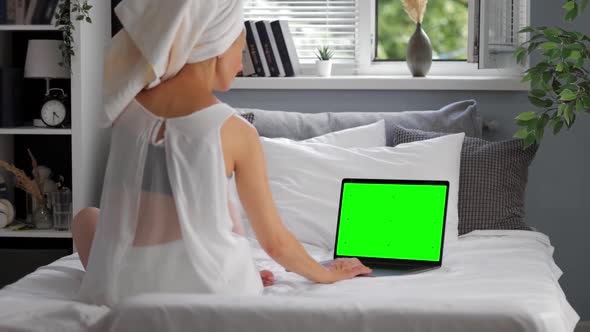 Woman with Green Screen Laptop