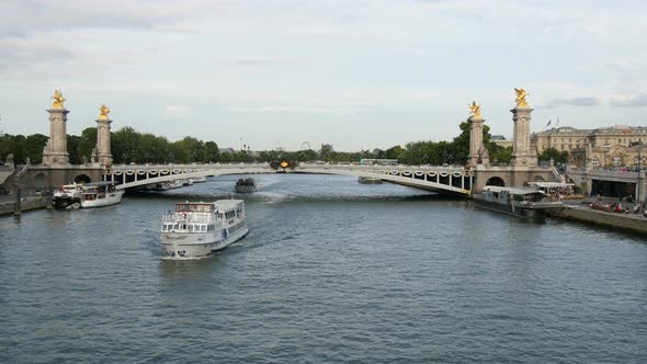 Sightseeing boats floating on Seine River alt