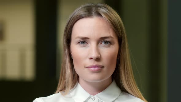 Portrait of successful Caucasian businesswoman standing with tablet computer