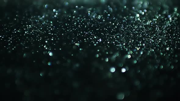 Cinematic background with green particles, Abstract motion of particles