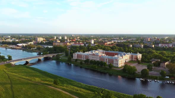 Aerial View of Jelgava City Panorama and Lielupe River in Latvia, Zemgale at Sunset 4K Dron Shot alt