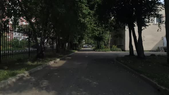 Drone view of asphalt road near preschool building 26 alt