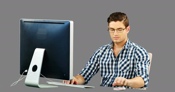 Man working on desktop alt