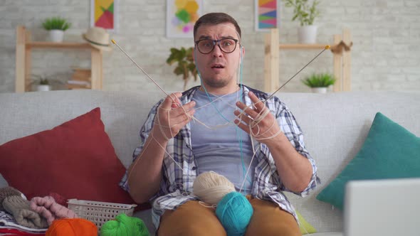 Clumsy Young Man with Glasses Knitting Needles alt