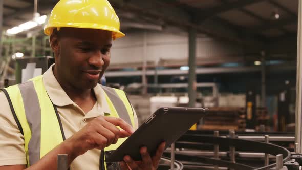 Worker Using Digital Tablet in Bottle Factory alt