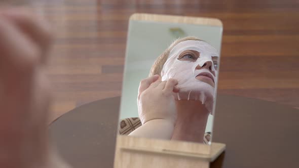 Mature Woman in Facial Mask for Face alt
