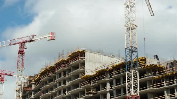 Tower Cranes Operate at Construction Site of New Building alt