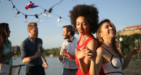 Group of Happy People or Friends Having Fun at Party alt