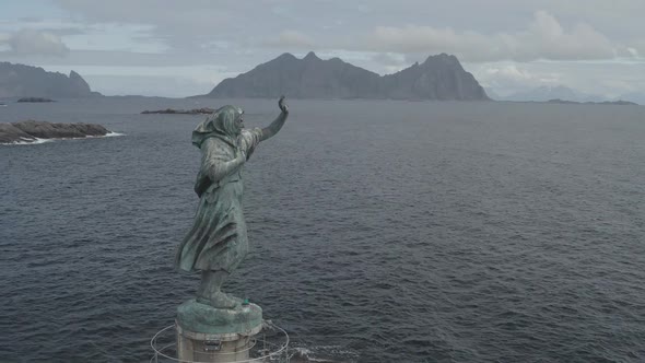 Statue On The Coast Of The Norwegian Mountains
