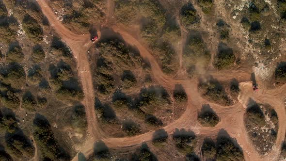 Wide aerial view of ATVs having fun in on the dirt trails in Cavo Greko alt