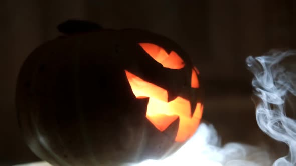Halloween Dark Background with Pumpkin Head. Slow Motion.