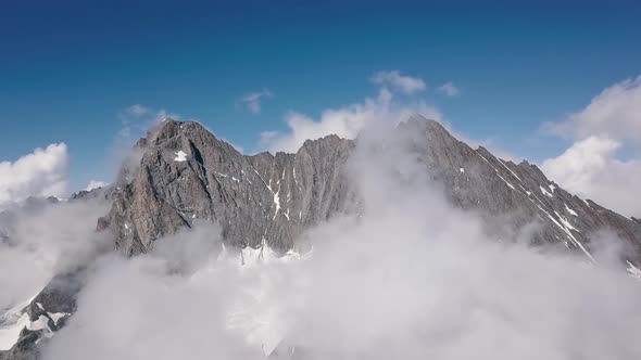 Aerial approach to the mountain range of the Schreckhorn peak in the Swiss alps in the Grindelwald r alt