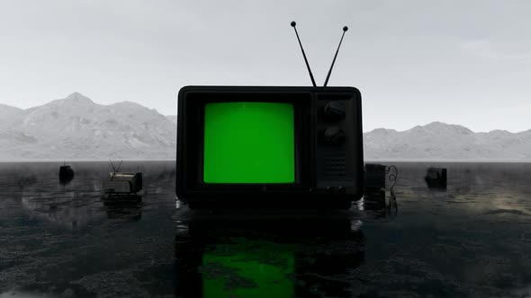 Old Black TV Standing on the Ground in the Rain