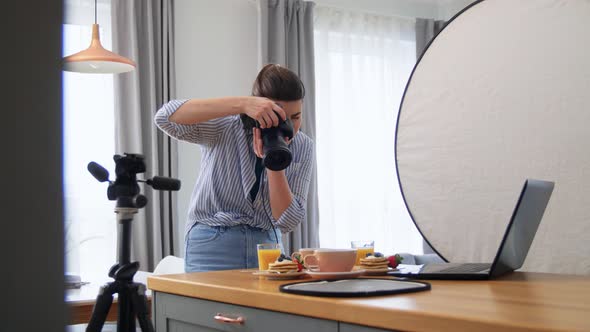 Food Photographer with Camera Working in Kitchen alt