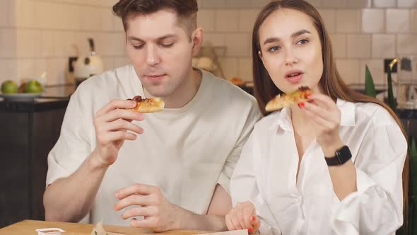 Married Couple Eat Pizza From Delivery Service