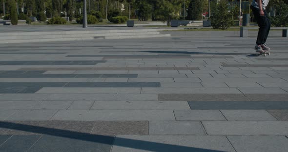 Skater Is Doing a Kickflip at the Skatepark in Slow Motion alt