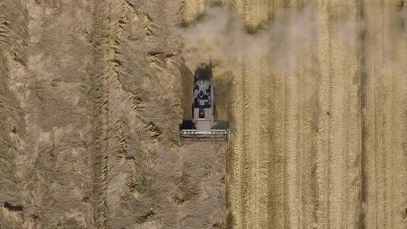 Top down view of combine harvester working the field