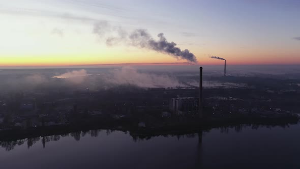 Aerial View of the Waste Incinerator Plant With Smoking Smokestack at the Sunset