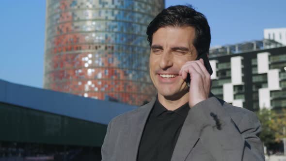 Businessman Talking Mobile Phone at Street. Executive Walking for Work Outside alt