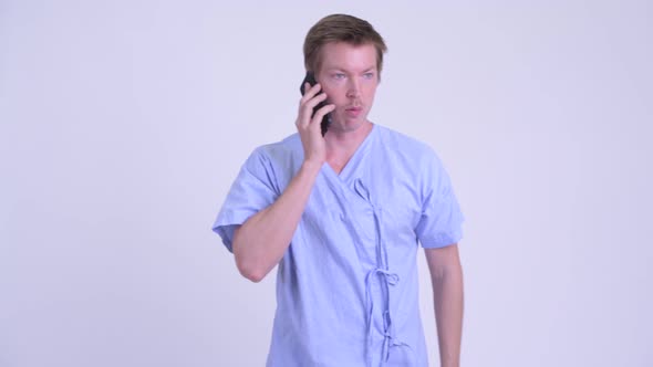 Young Man Patient Talking on the Phone and Farting alt