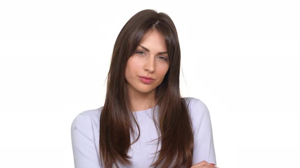 Tired Caucasian Young Lady Heavily Sighing in Disappointment and Waving Her Head Over White alt