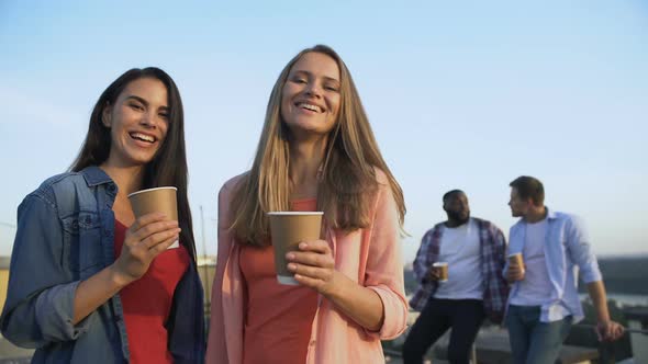 Smiling Female Friends With Cocktails Looking at Camera, Roof Party, Relax