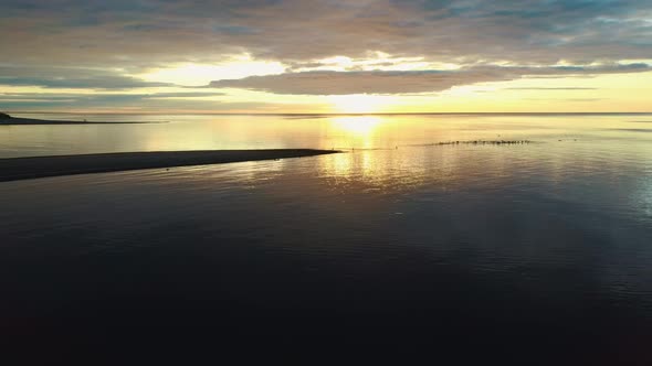 The Gauja River Flows Into the Baltic Sea Gulf of Riga Aerial 4K Shot alt