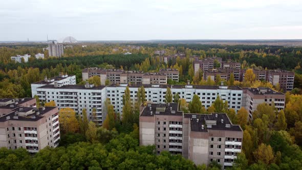 A Drone View of the Abandoned Chernobyl Houses Completely Overgrown with Trees