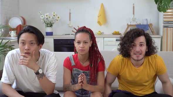 A Group of Football or Sports Fans Watch TV at Home and Rejoice at the Victory alt