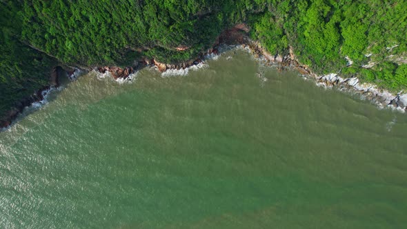4K aerial top view, coast of mountains by the sea alt