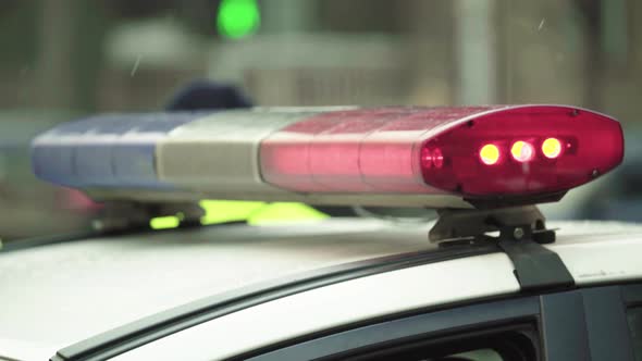 Police Flasher Flashing on the Roof of the Patrol Car alt