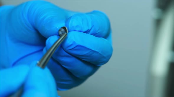 Dental Technician Treats Implant Before Fixing