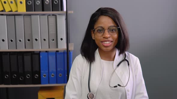 Young Indian Female Doctor Make Online Video Call Consult Patient alt