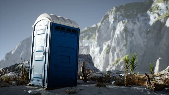 Portable Mobile Toilet in the Beach. Chemical WC Cabin alt