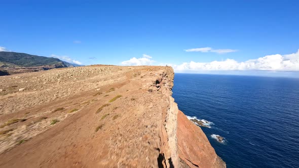 FPV Racing Drone Mountain Surfing and Cliff Diving Along the Rocks alt