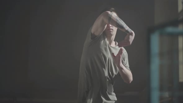 Portrait of Young Skillful Rapper Dancing on the Street alt