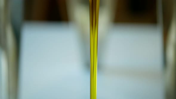 Olive Liquid Oil Organic Quality Bio, Obtained From Olives, Bubbles Active, Mixing and Pouring in a