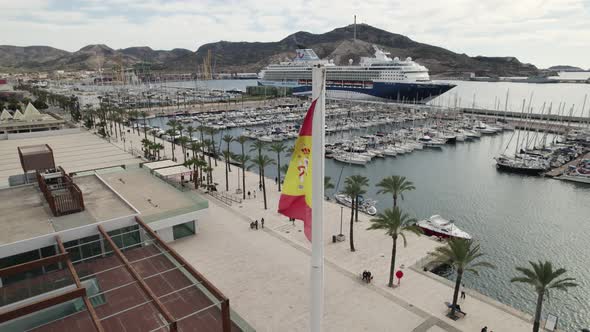 Yachts docked at marina in Cartagena, Spain. Cruise ship in background