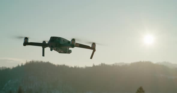 Flying UAV Drone Moves in Different Directions and Spinning in Sky