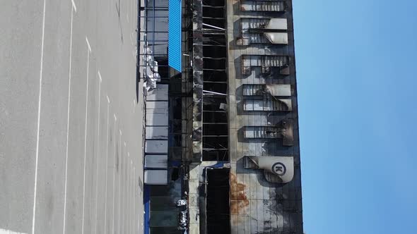 Vertical Video of a Destroyed Building of a Shopping Center in Bucha Ukraine alt