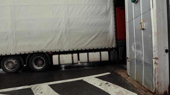 Truck Drives Through Logistics Center