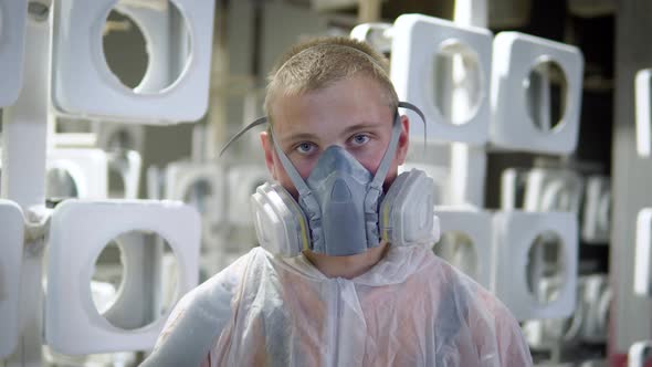 Portrait of a Man in a Mask in the Paint Shop