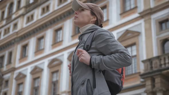 Tourist looks at the architecture.  alt