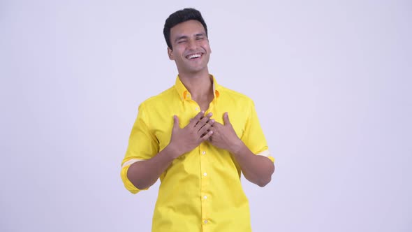 Young Happy Indian Businessman Looking Surprised alt