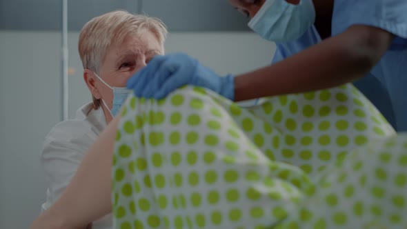 Close Up of Obstetrician Assisting Childbirth in Hospital Ward alt